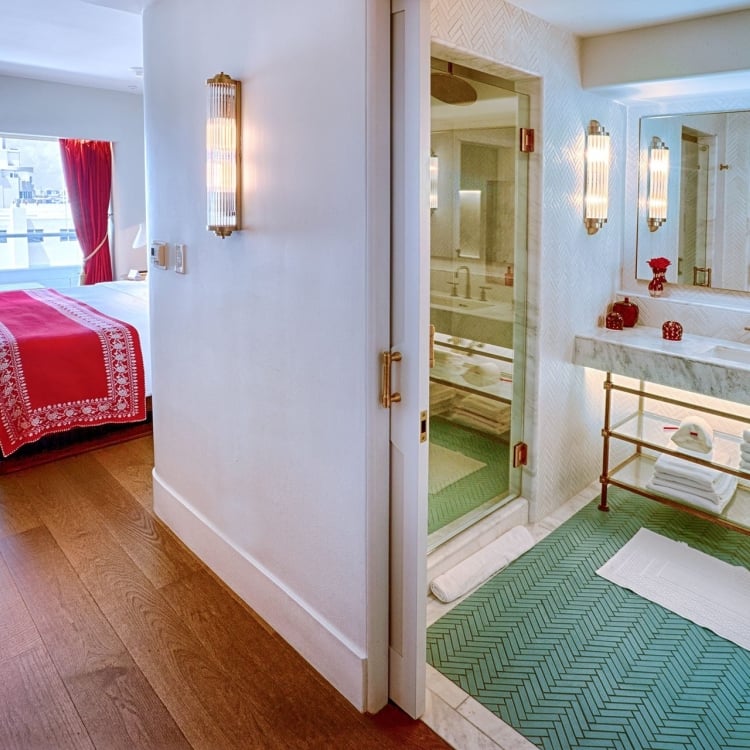 ocean view hotel room looking into bathroom 