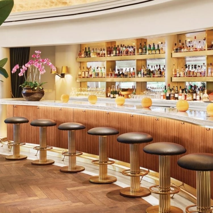 Fancy bar lined with stools