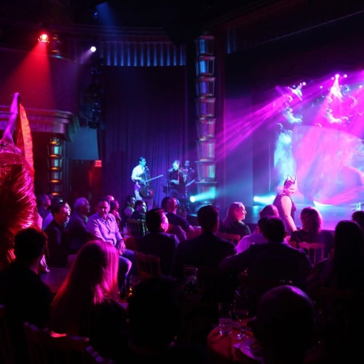 samsara performers on stage surrounded by audience