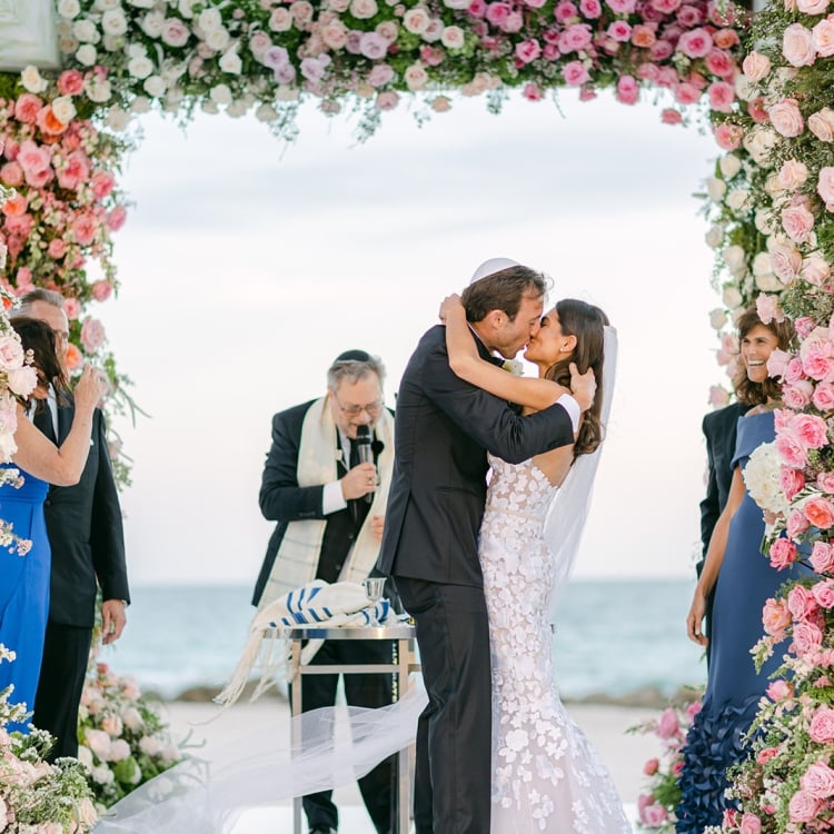 Allison and Robert Zale kissing at the alter