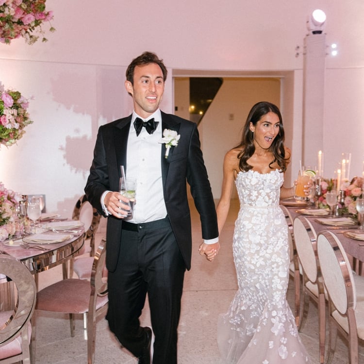 Allison and Robert Zale walking into the Wedding reception area
