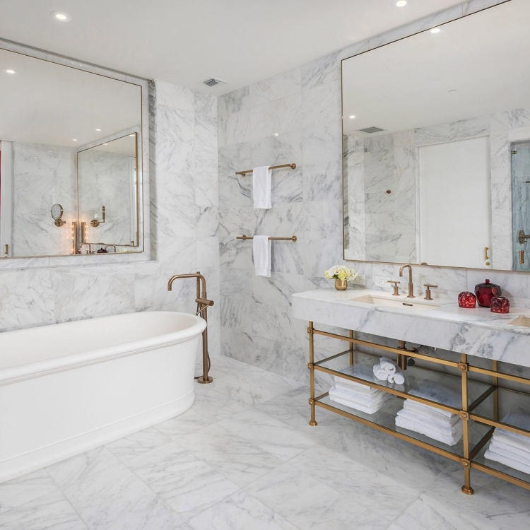 hotel bathroom with large stand alone bathtub