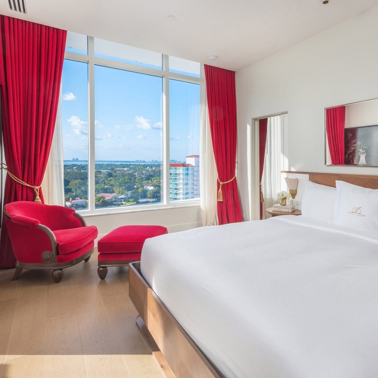 hotel bedroom with large windows 