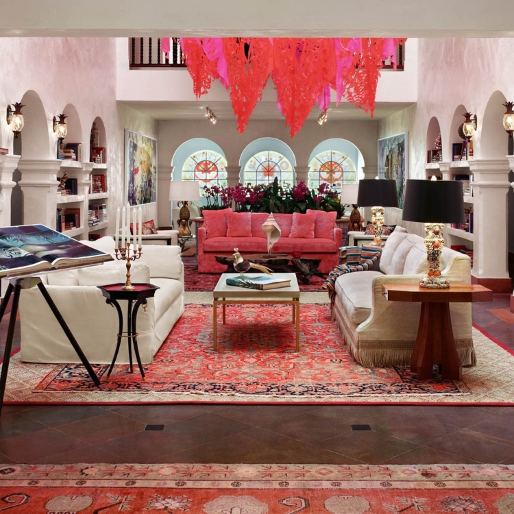 casa faena atrium with bookshelves and couches
