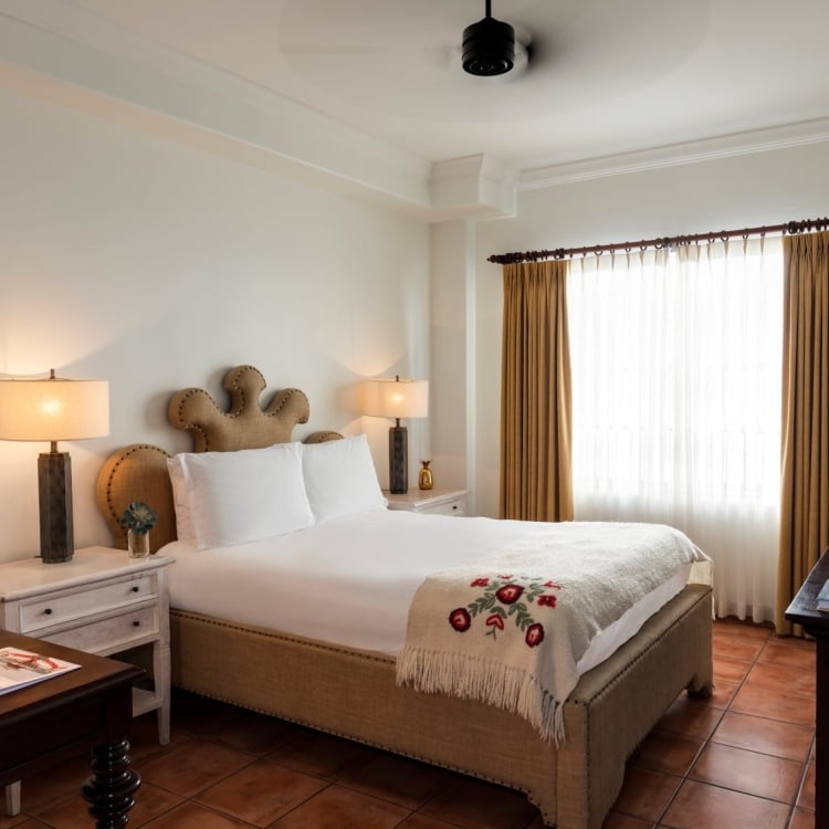 hotel bedroom with bed fitted with white linens