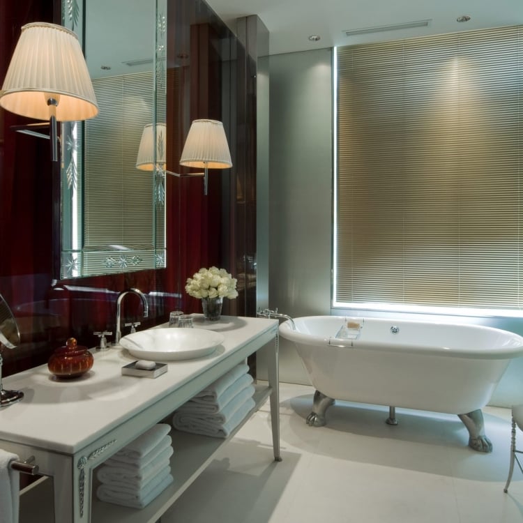 hotel bathroom with large stand alone bathtub