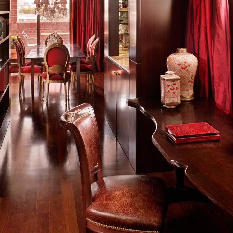 wooden desk and chair with dining table in the background