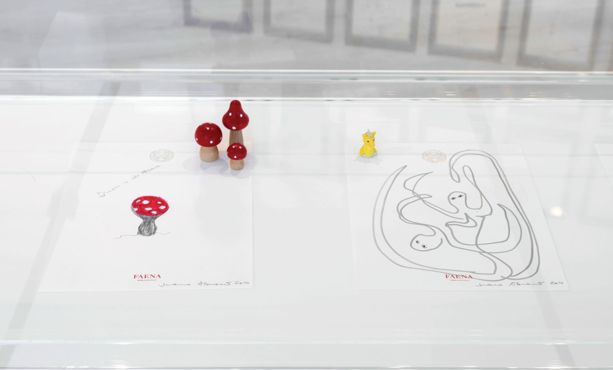 Artwork being displayed in a glass case