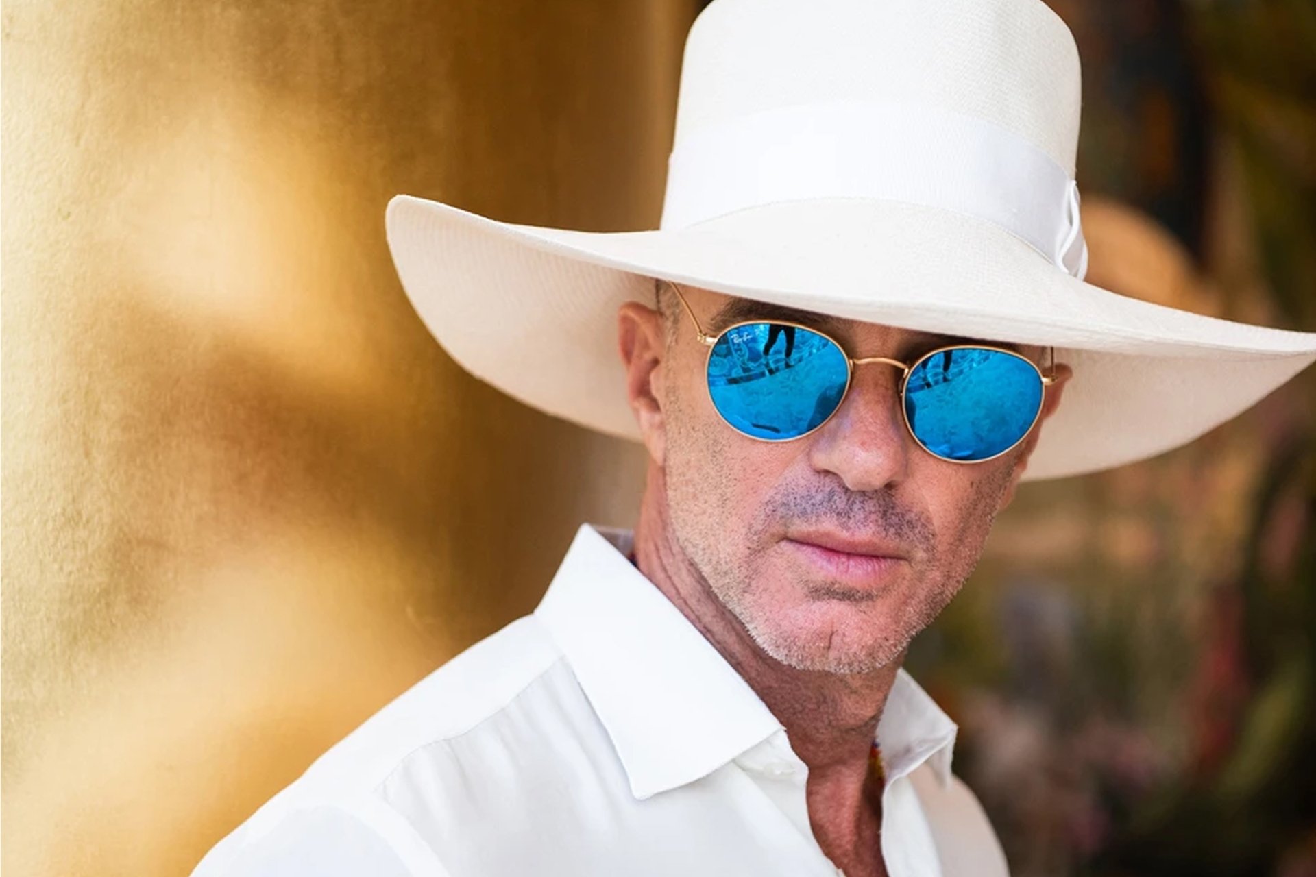 Alan Faena in a white hat and sun glasses
