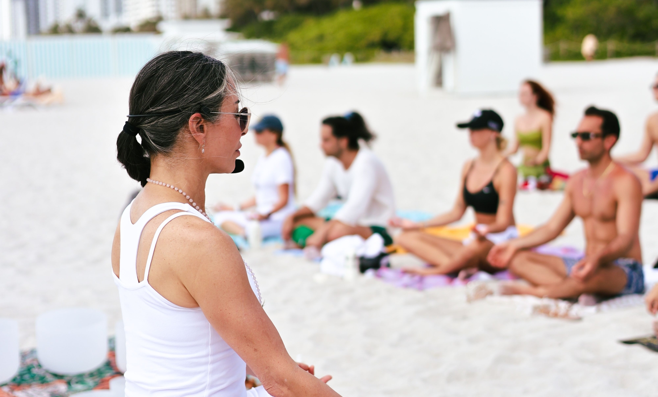 Agustina leading a yoga class on the beach