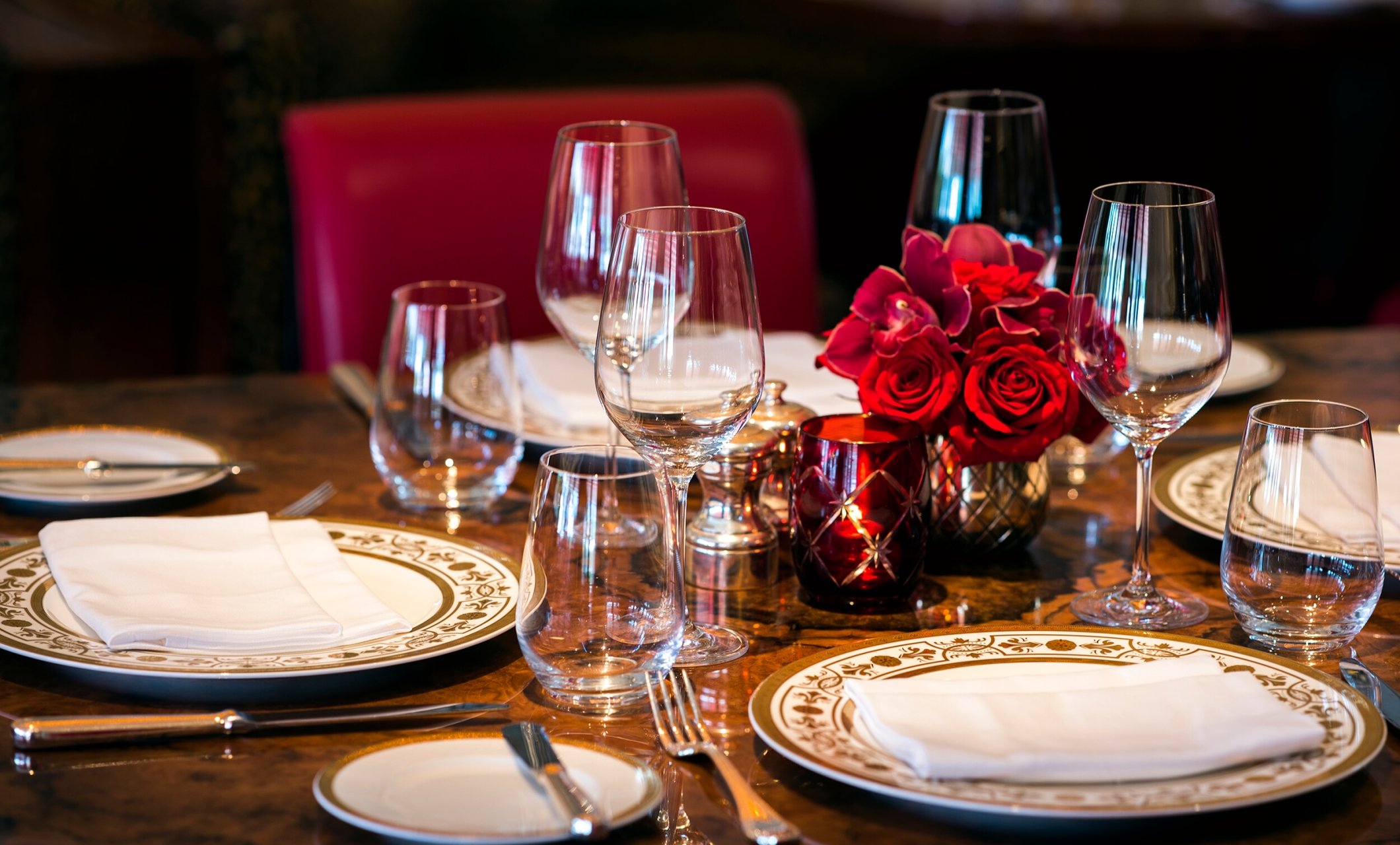 Table setting with plates and wine glasses