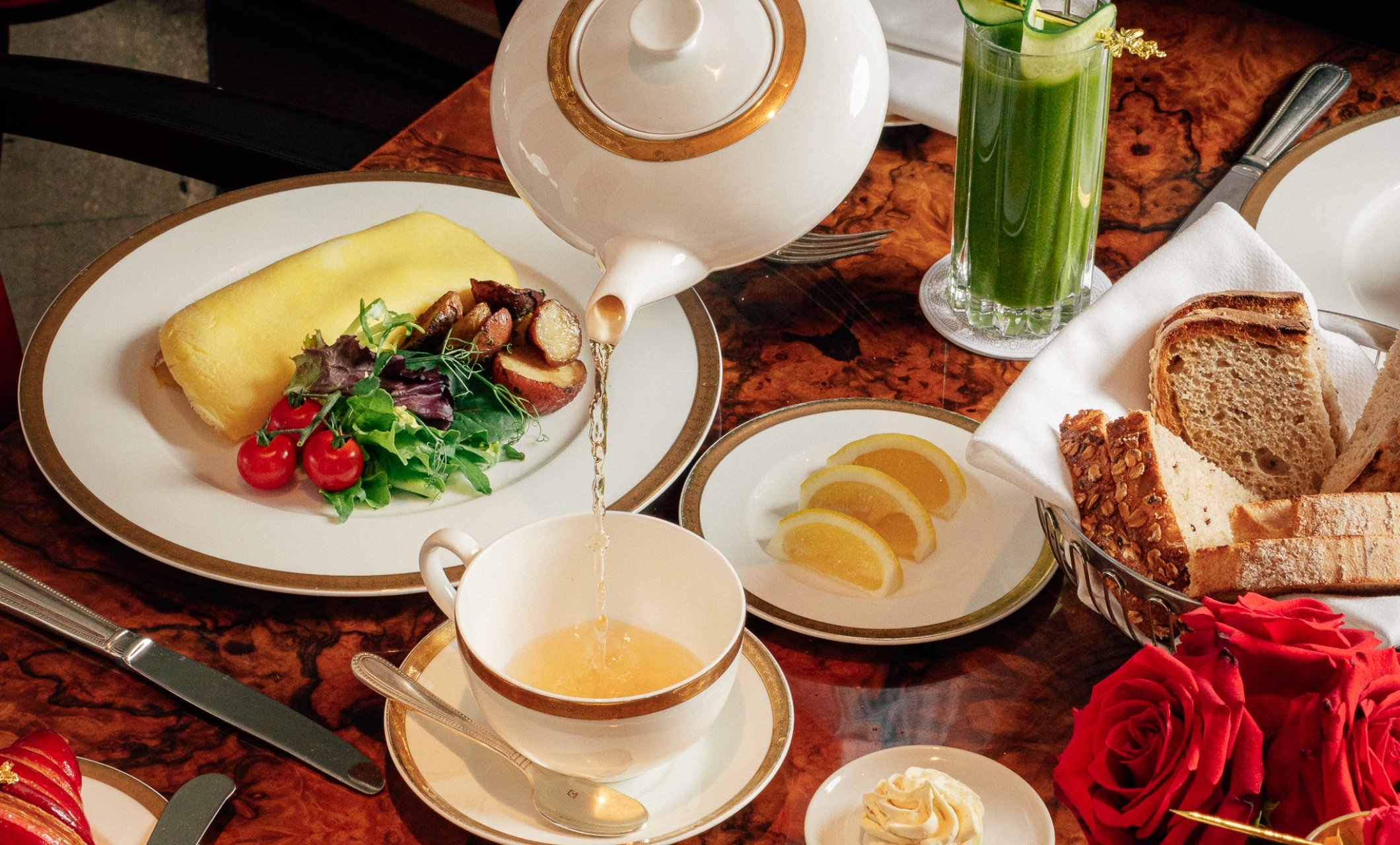 Tea being poured in room dining