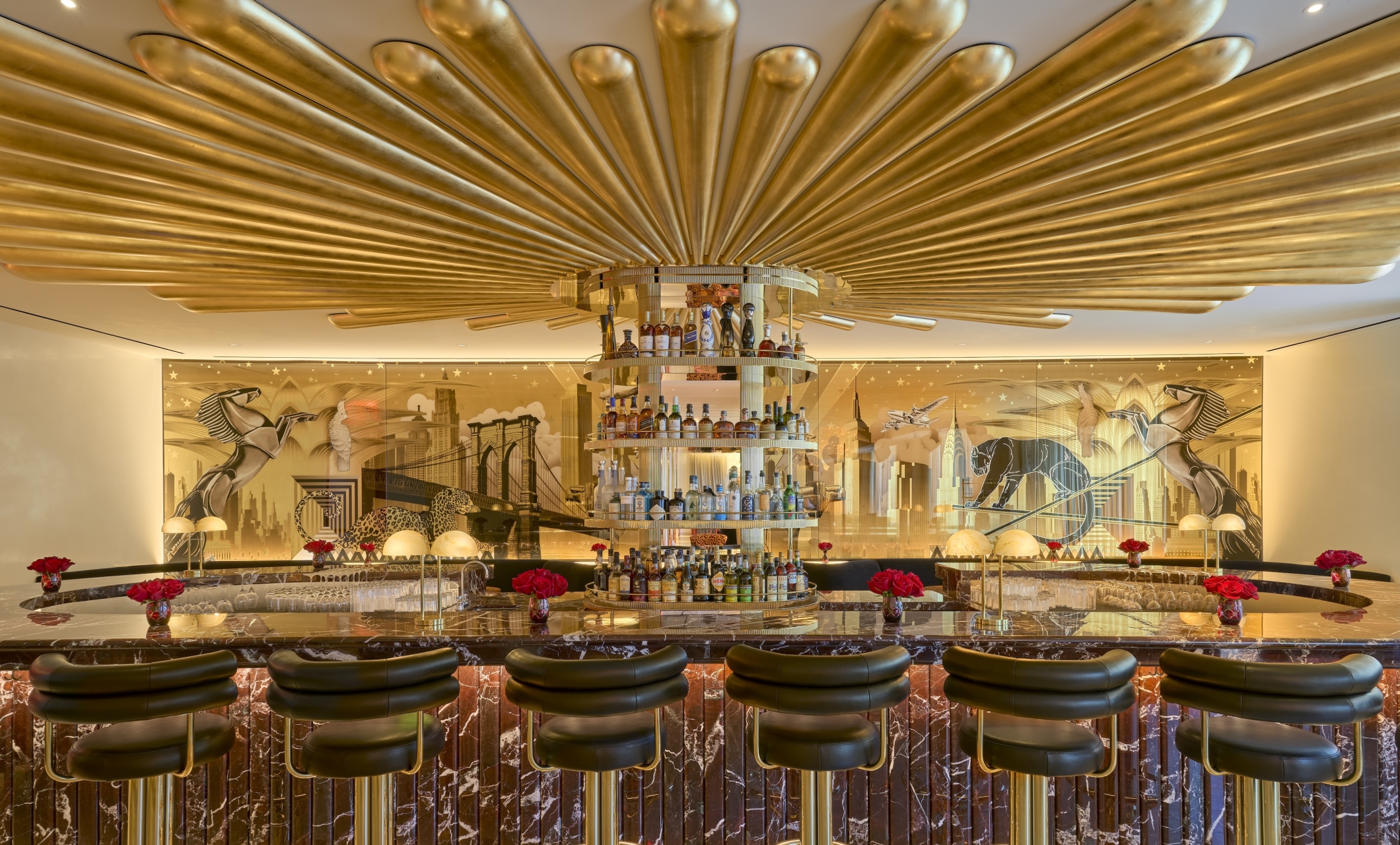 The Living Room, a stylish open bar with gold adornments, at Faena New York