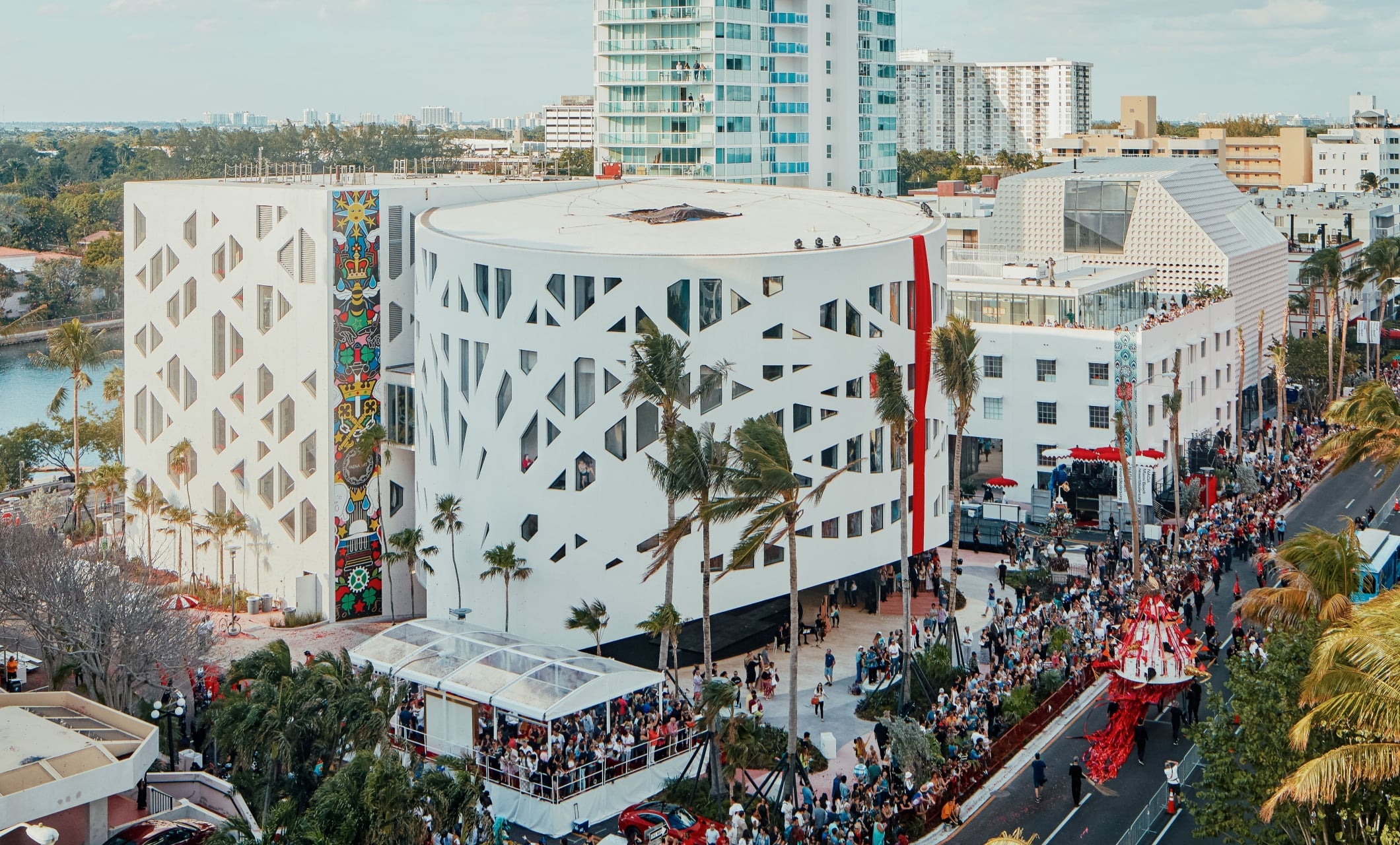Aerial view of Faena Forum in Miami Beach, featuring its distinctive architecture and a vibrant outdoor event.