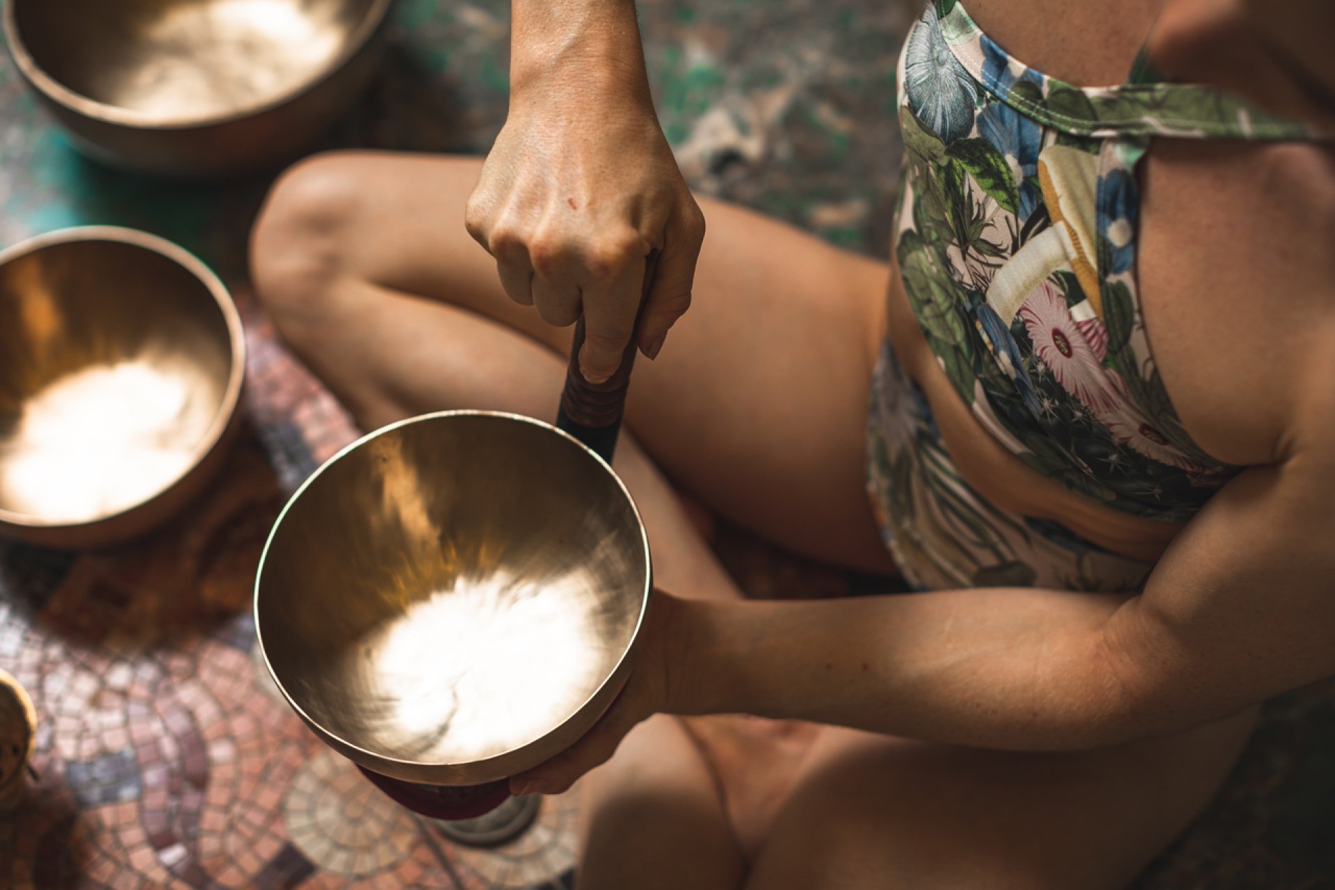 woman holding singing bowl