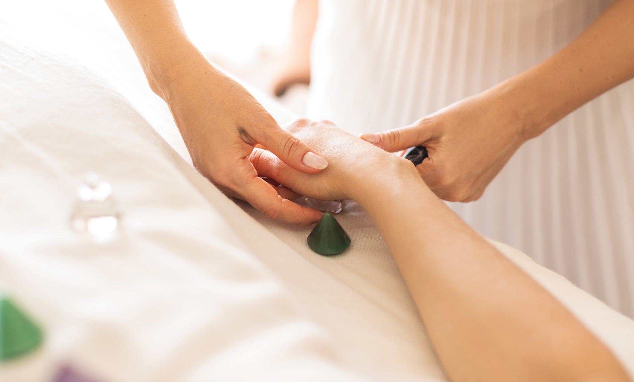 a person receiving a hand massage