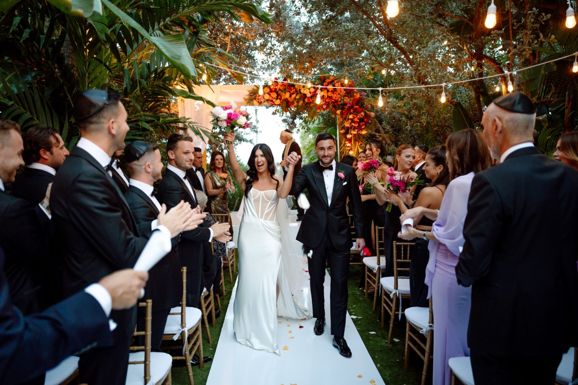 Bride and groom after wedding ceremony walking down the aisle