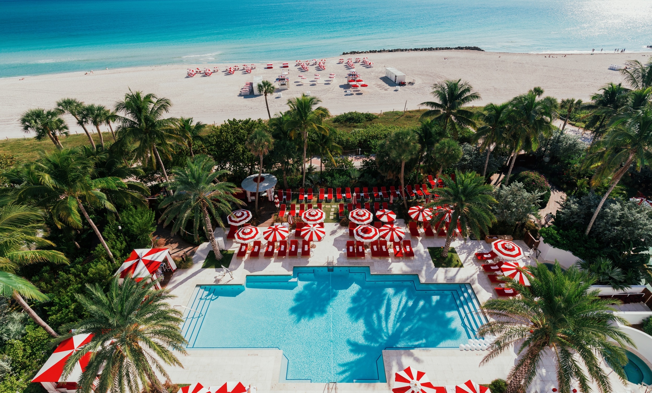 Aerial view of hotel pool on the edge of beach
