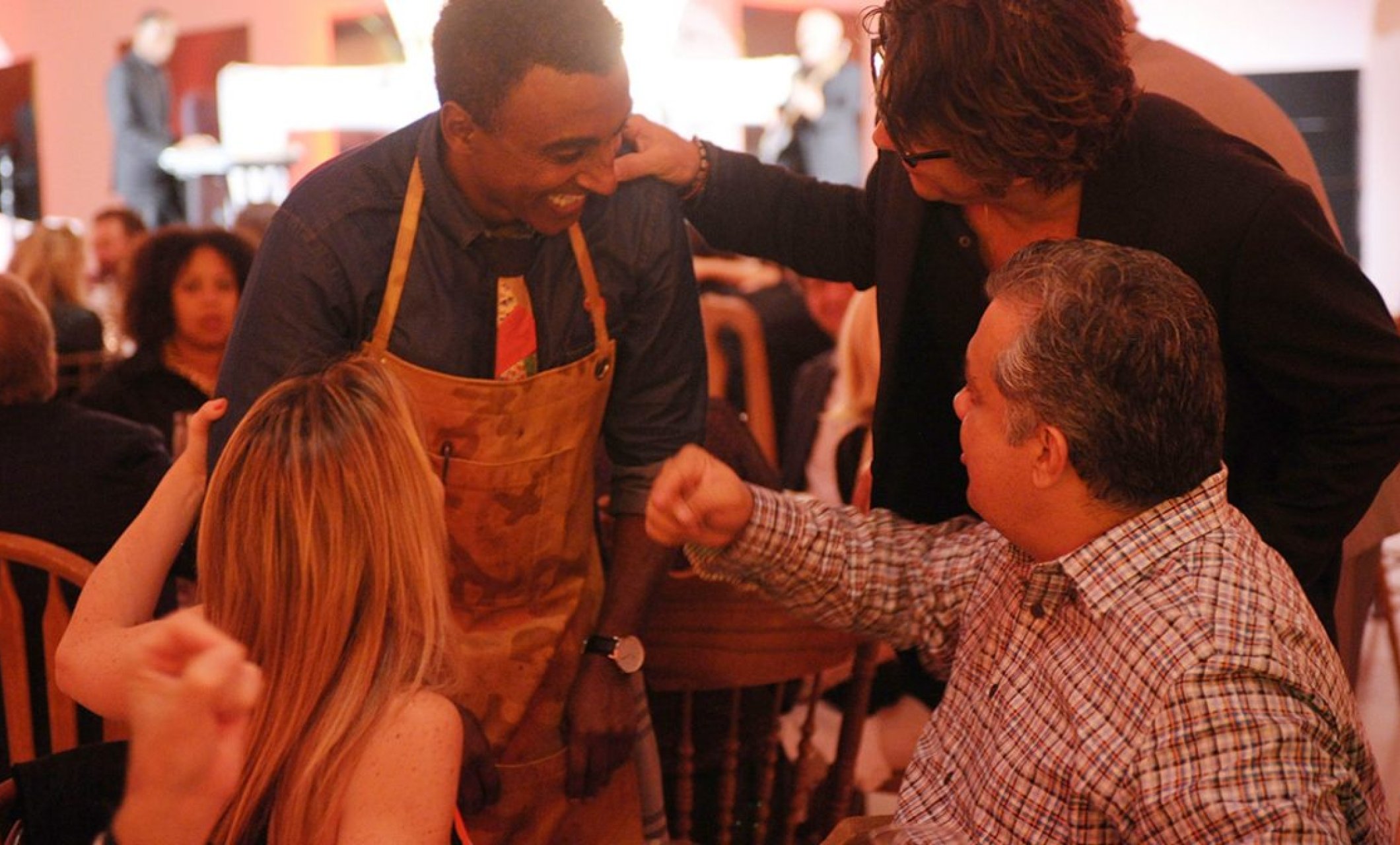 group of chefs and audience members chat amongst themselves