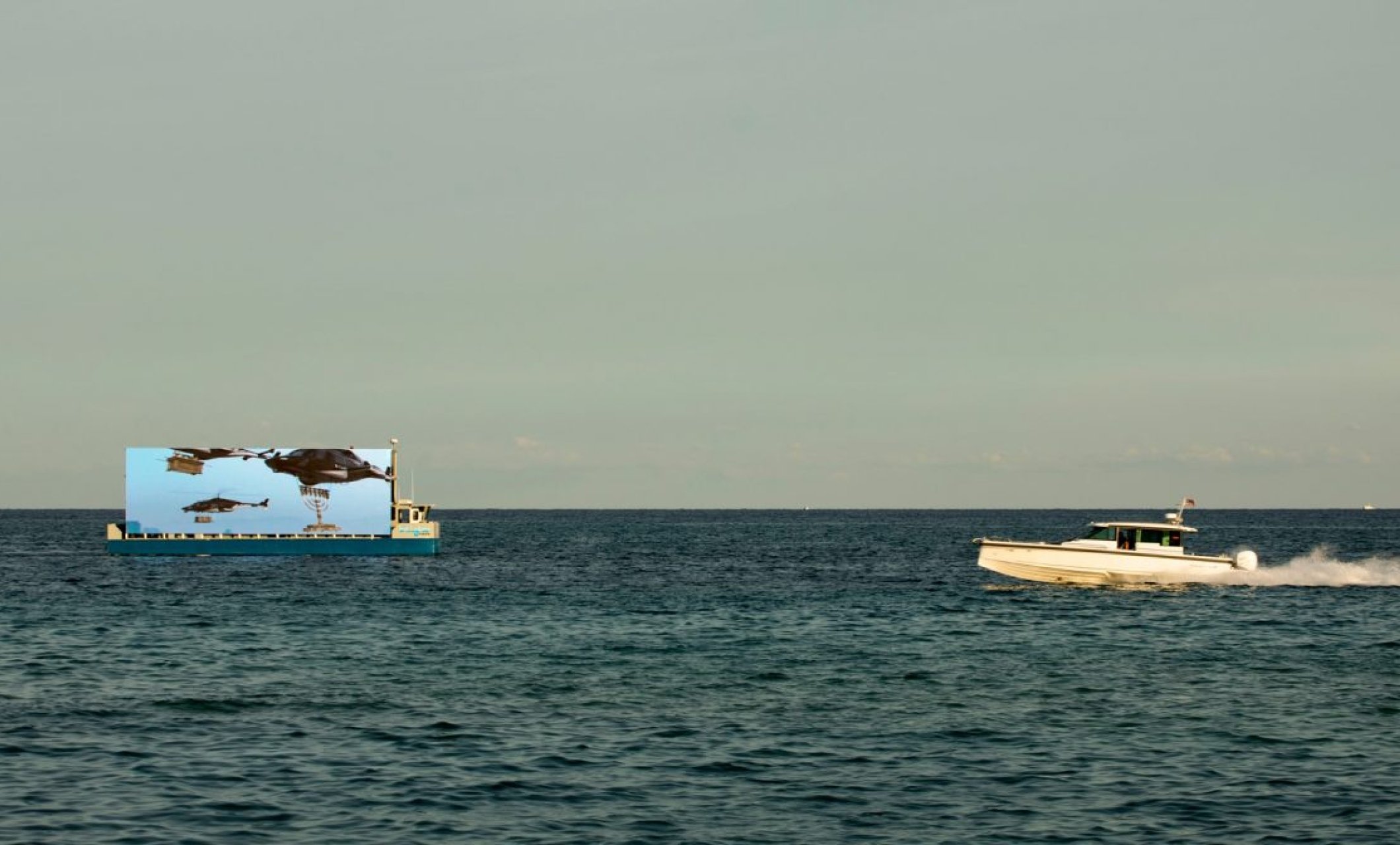 film showing floating screen off shore of Miami Beach