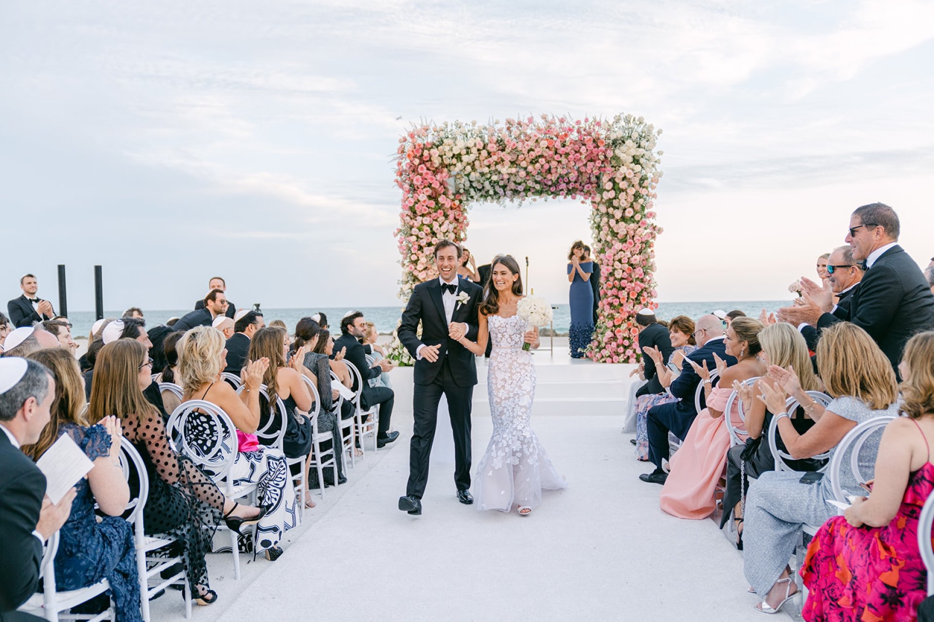Allison and Robert Zale walking down the aisle after getting married