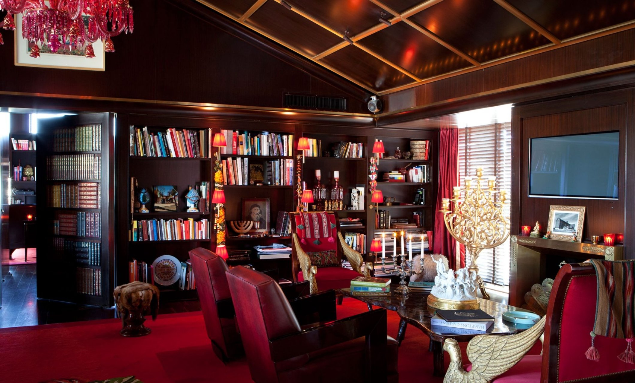 Sitting area in Faena Suite with large library on wall