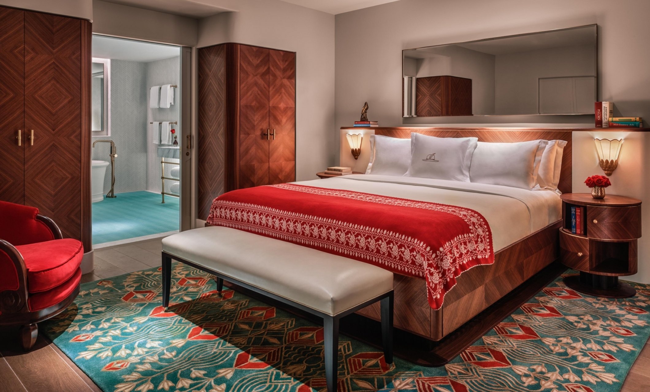 hotel bedroom with bathroom in background