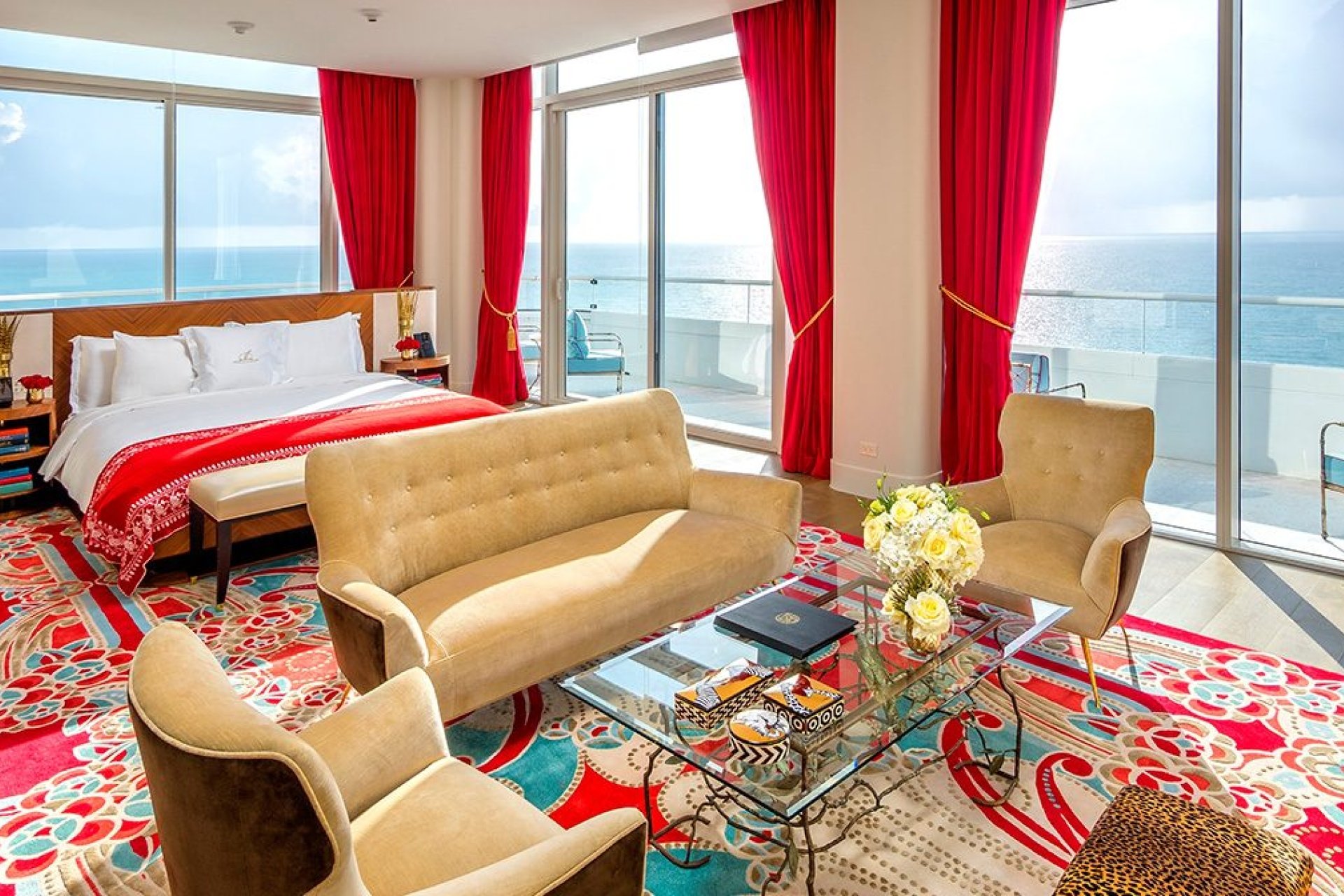 hotel bedroom with sitting area containing couch and two chairs