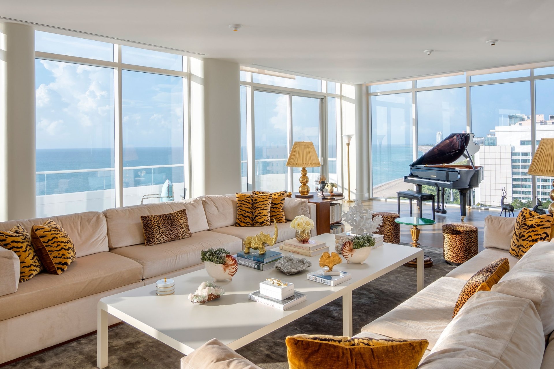 penthouse living area with grand piano in the background