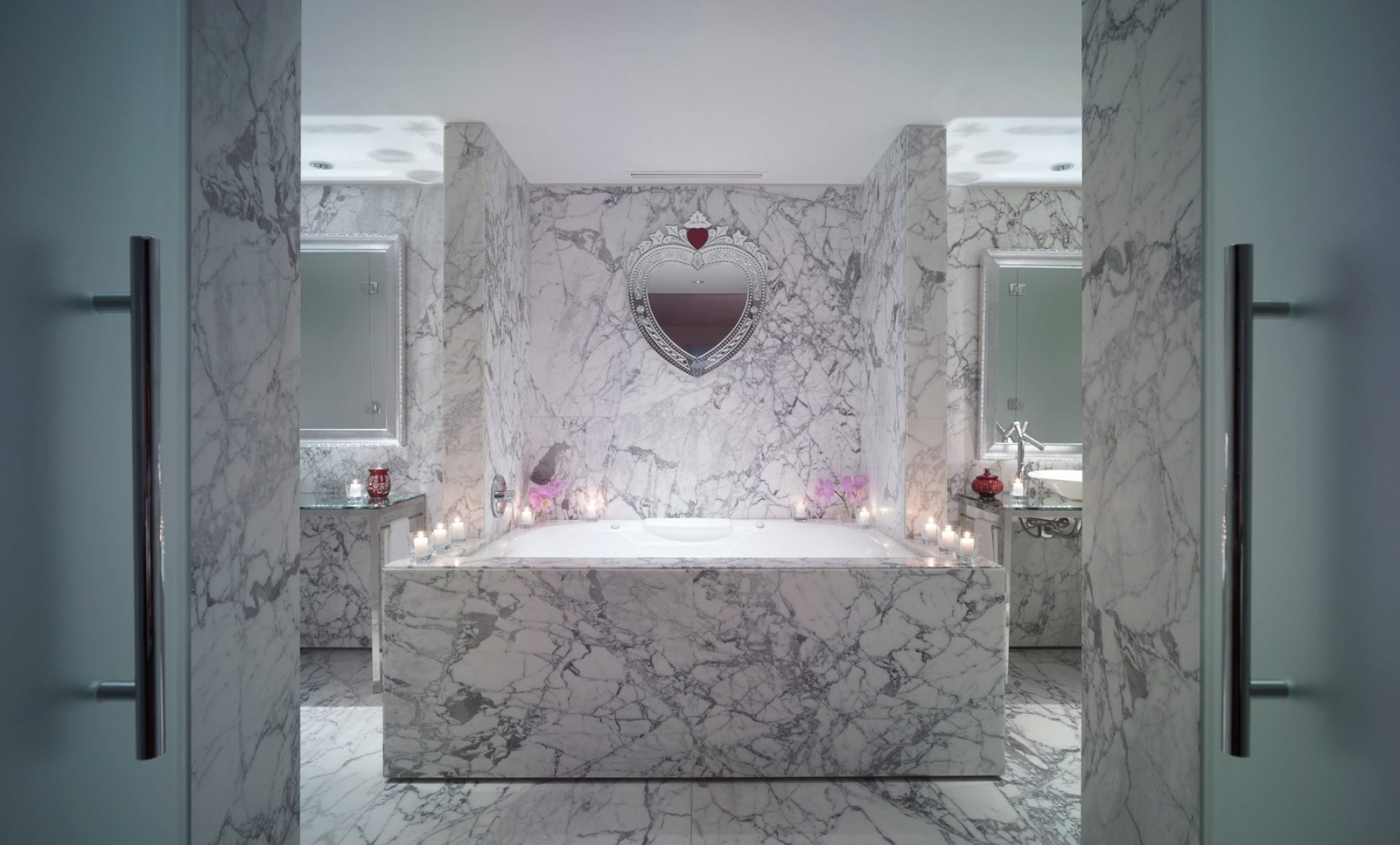 large marble bathtub in hotel suite