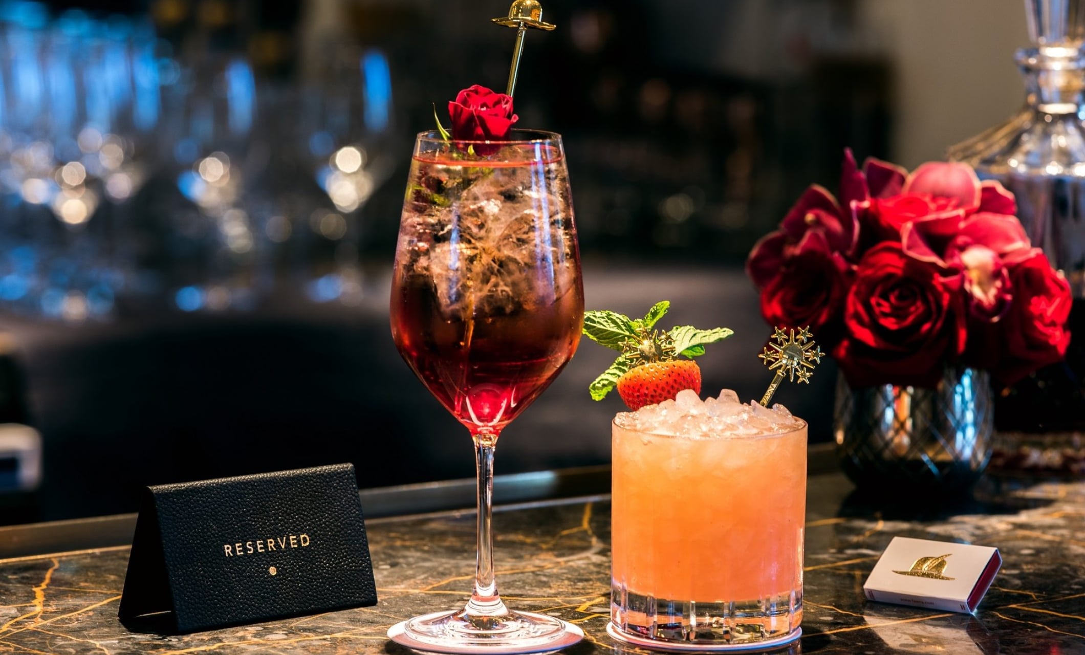 two cocktails on a bar