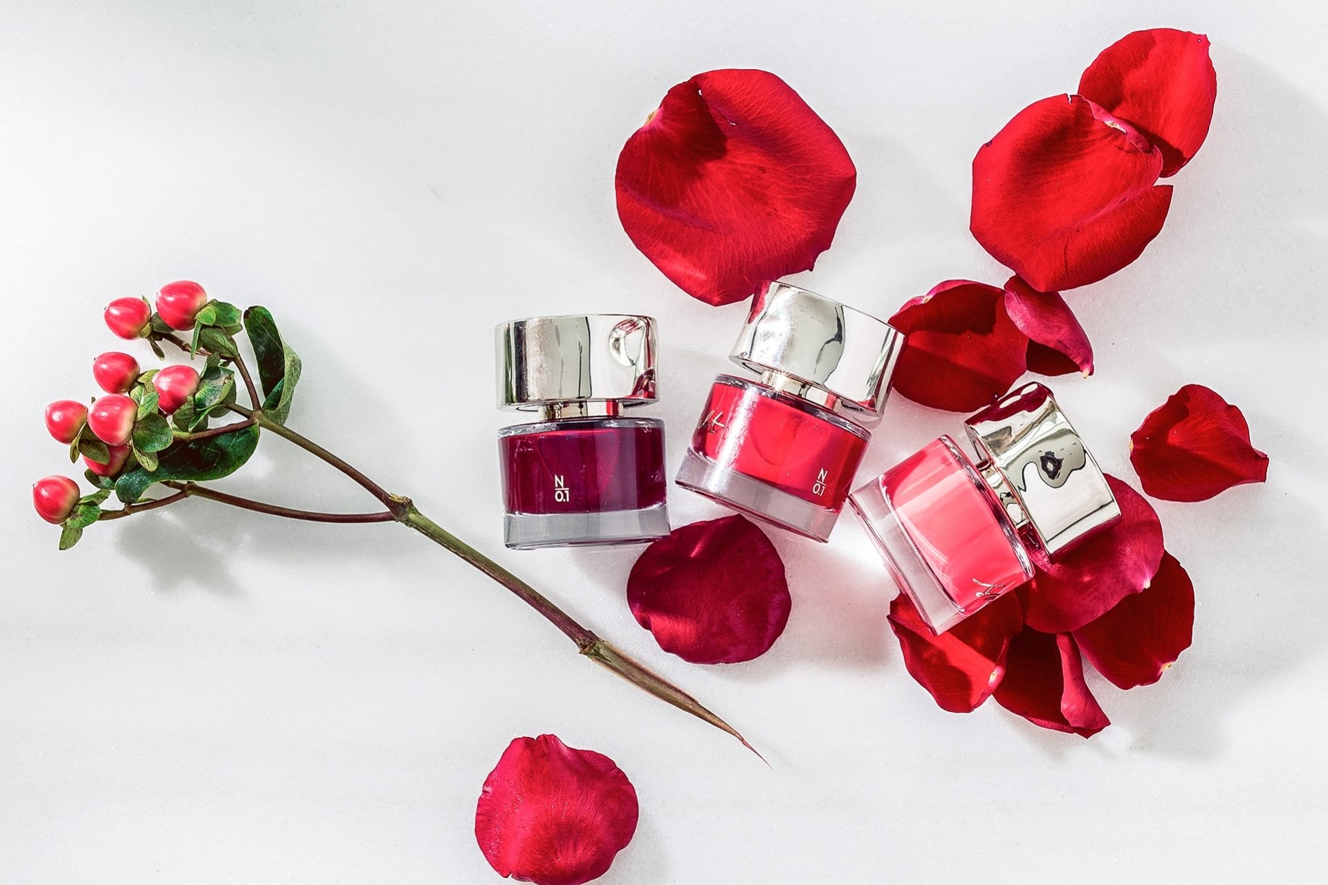 rose petals and small glass bottles 