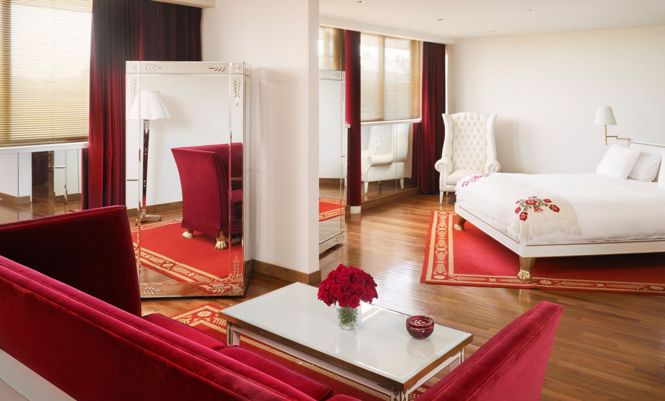 hotel suite with bed and seating area