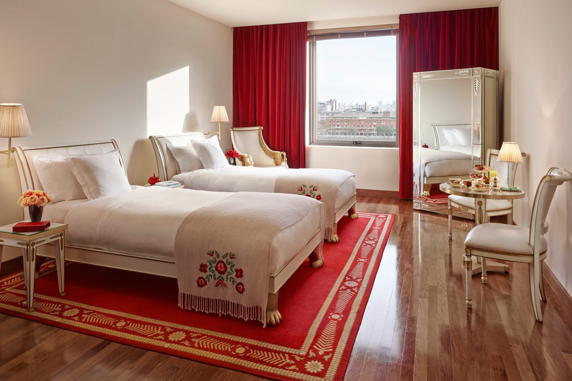 two hotel beds with white linens