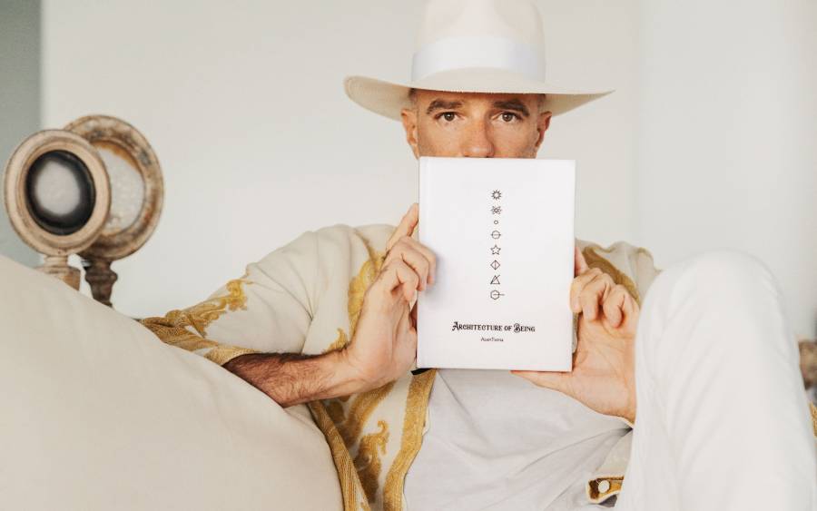 Alan Faena holding book Architecture of Being