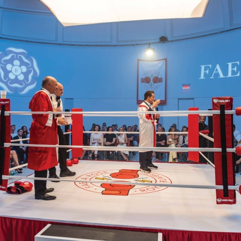 Three men in a boxing ring