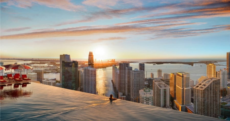 Woman swimming in a pool on the roof of a building