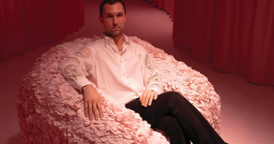 Andrés Reisinger sitting in a fluffy chair