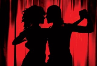 man and woman in silhouette dance the tango