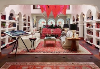 casa faena atrium with bookshelves and couches