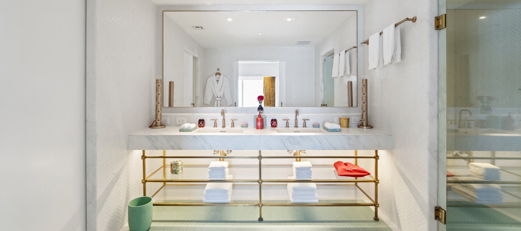 Bathroom with large two sink vanity with shelves underneath