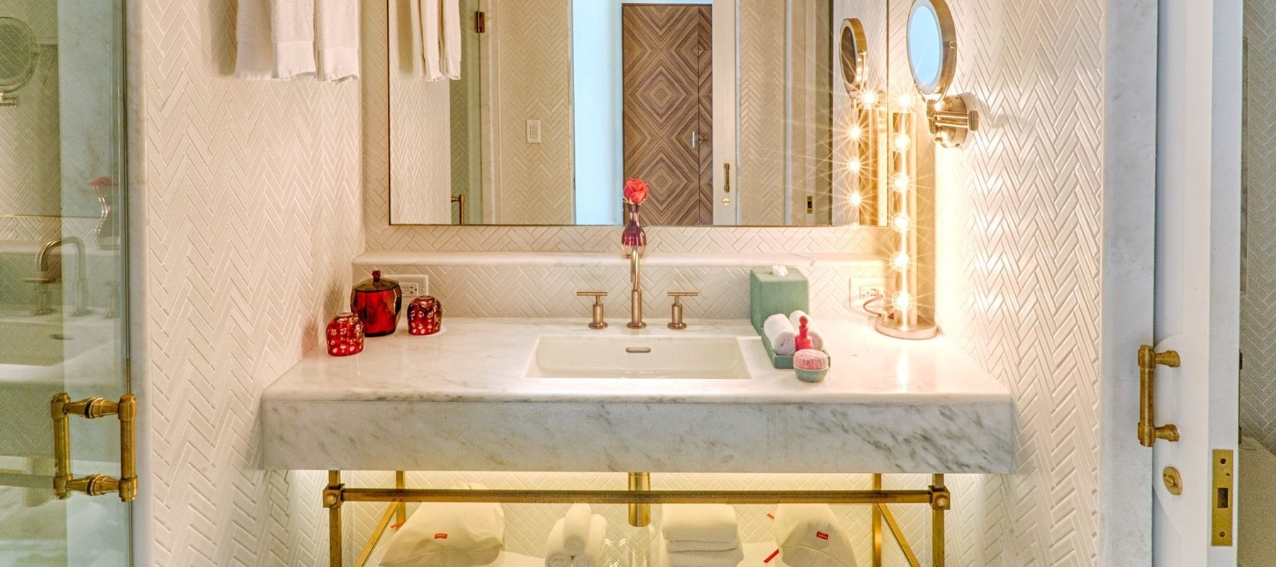 hotel bathroom with large mirror and sink