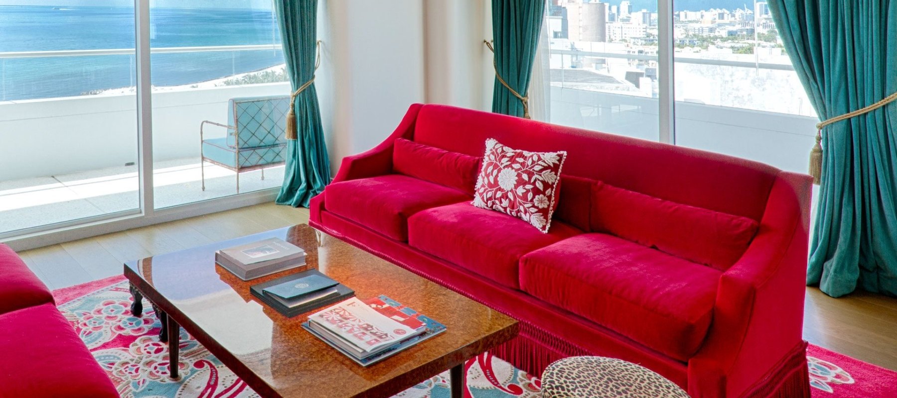 living room in imperial suite with red couch