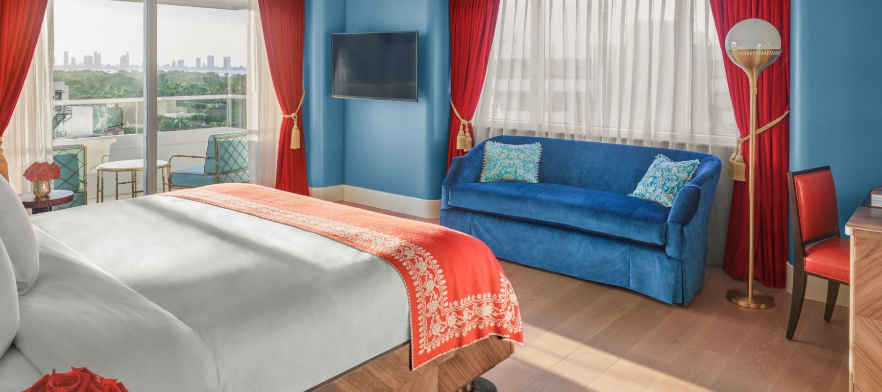 hotel imperial suite bedroom with bed and couch