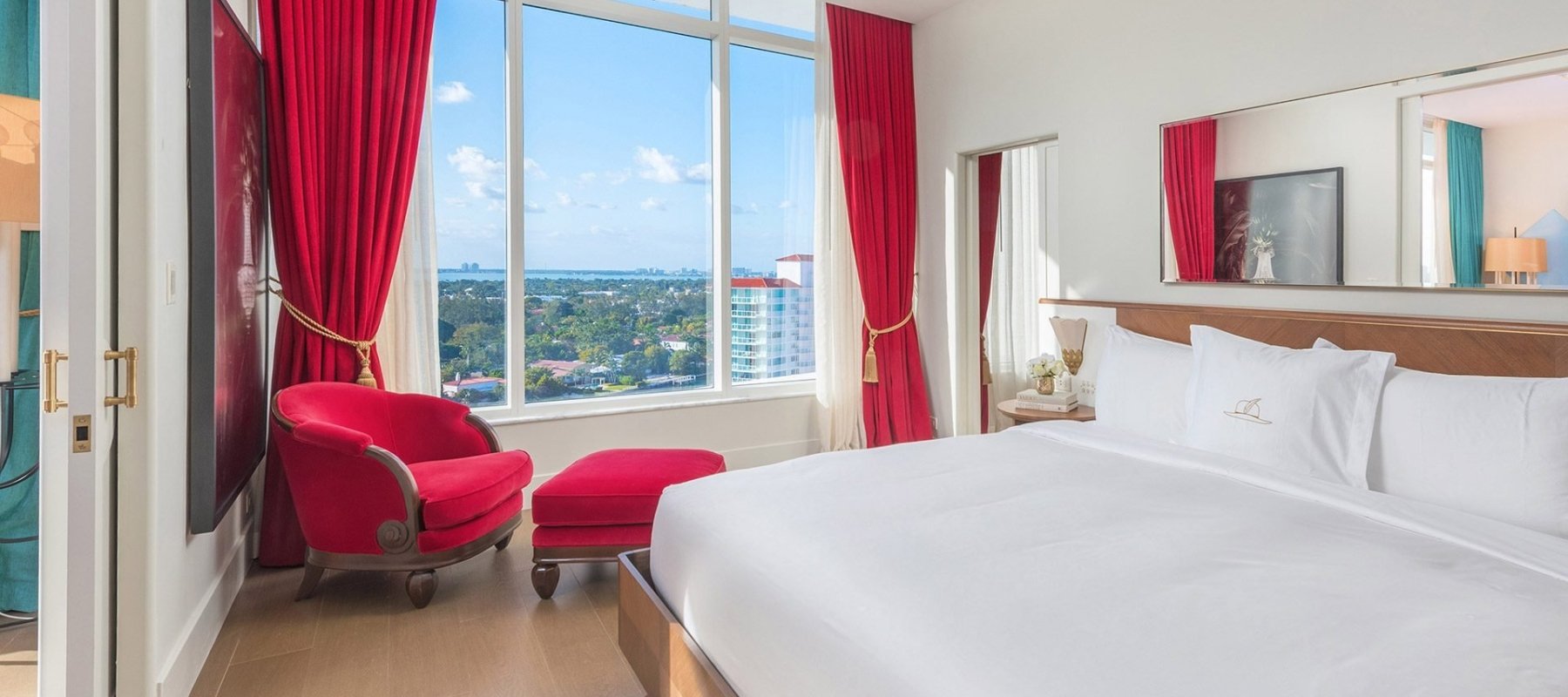 hotel bedroom with large windows 