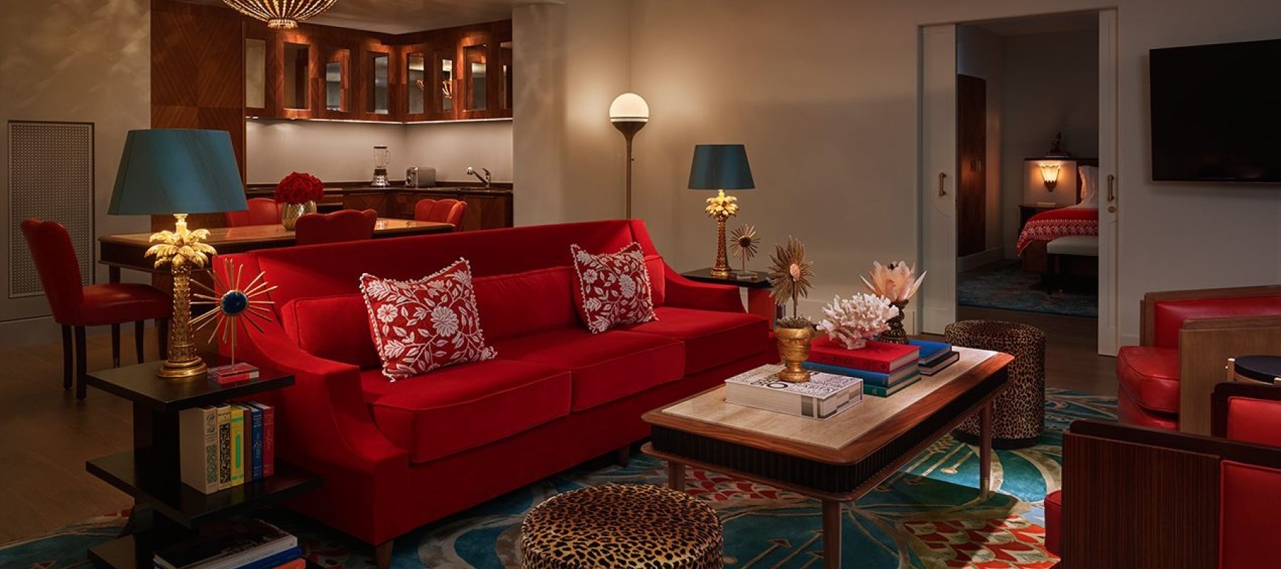 red couch seating area of hotel suite