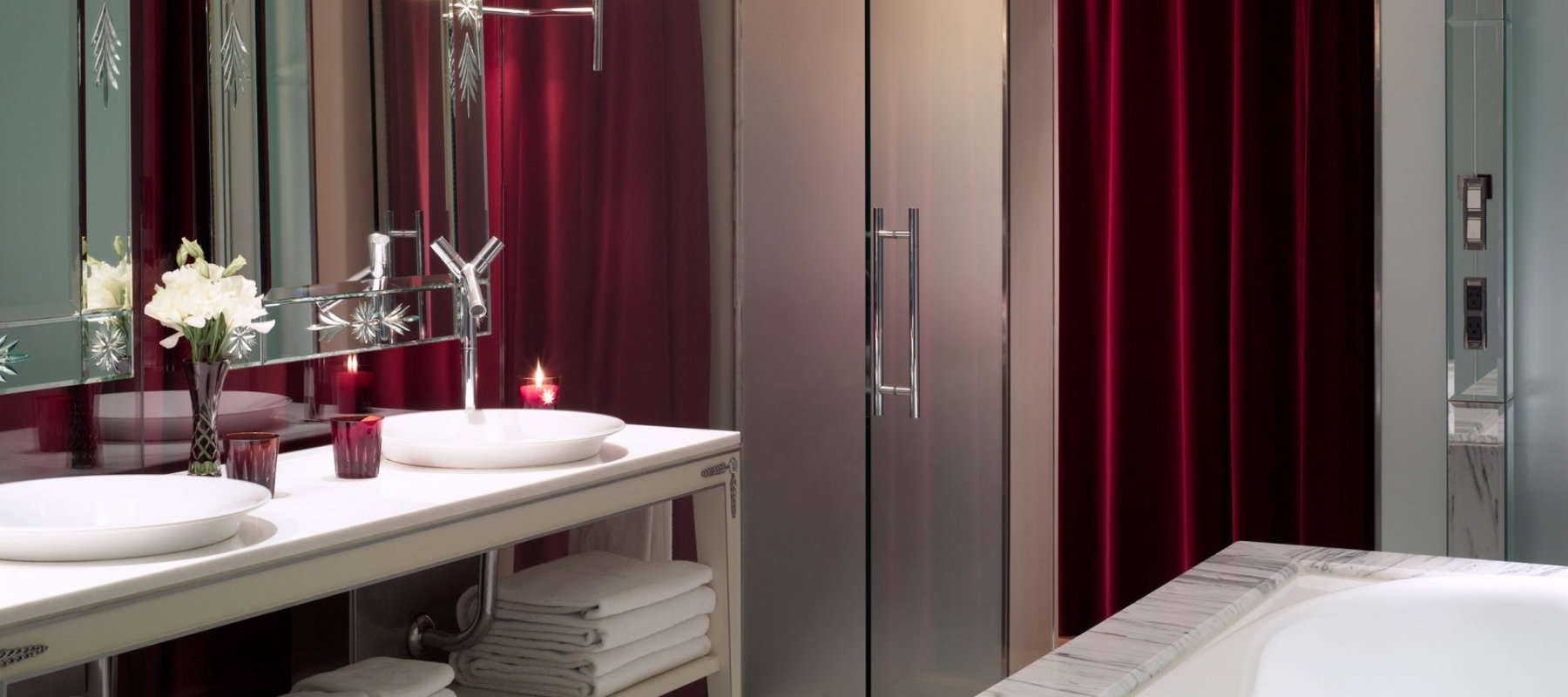 bathroom with double sink vanity and bathtub