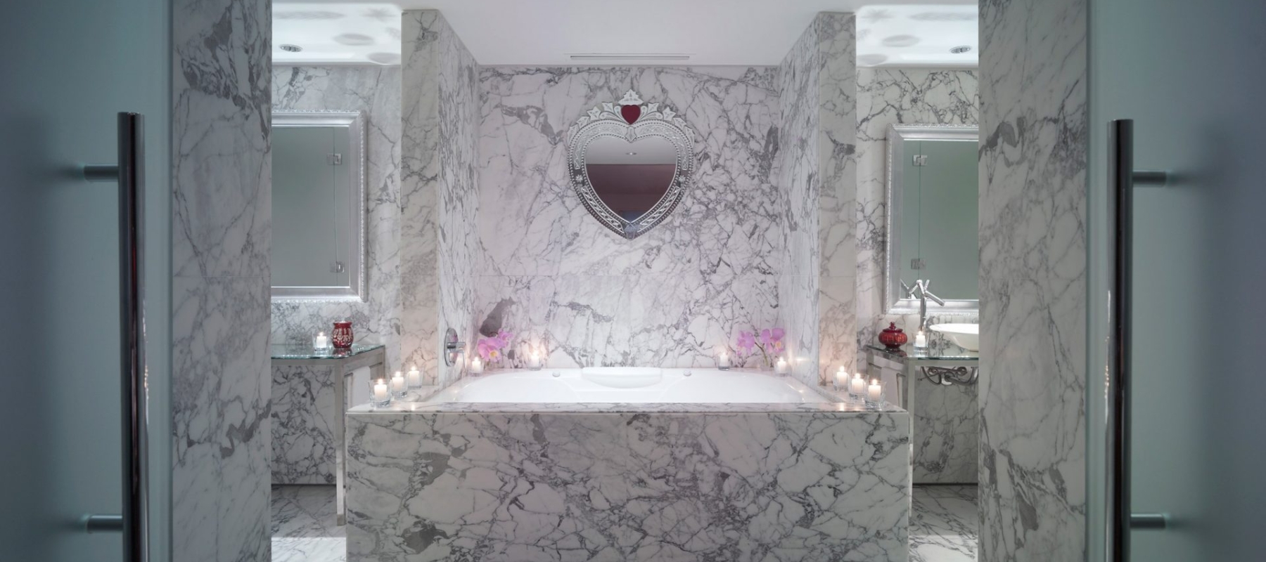 large marble bathtub in hotel suite