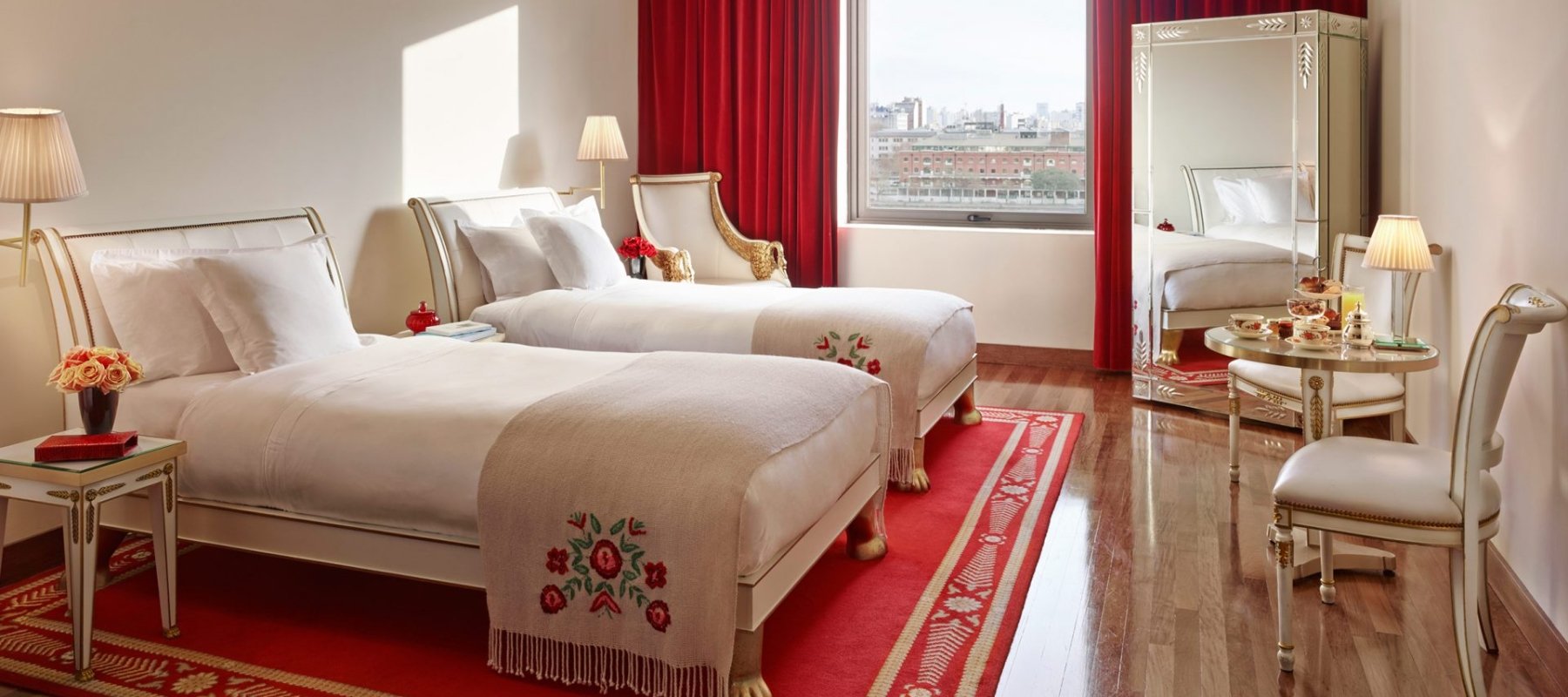 two hotel beds with white linens