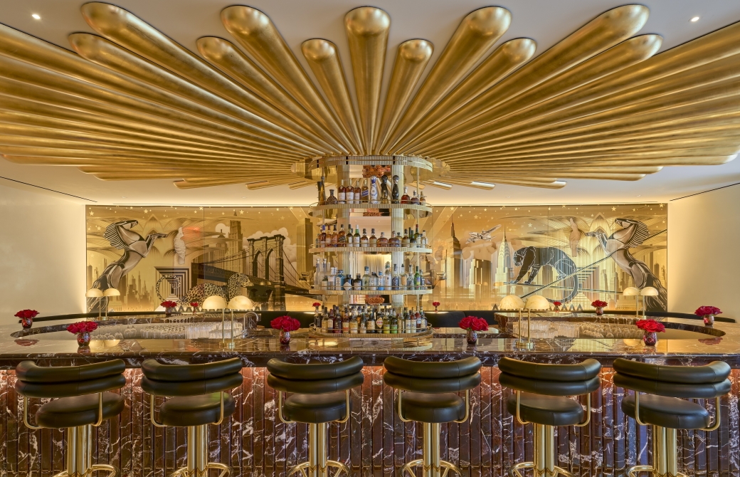 The Living Room, a stylish open bar with gold adornments, at Faena New York